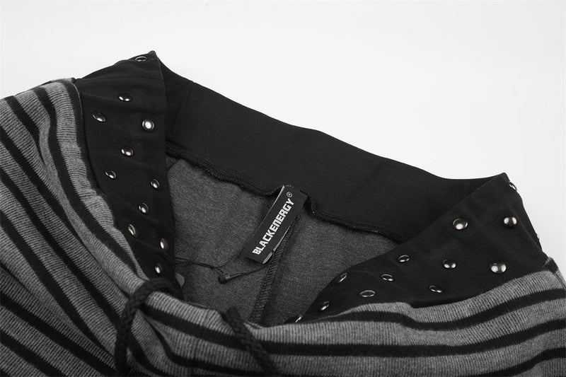 Inside waistband with brand tag on striped pants, close-up detail
