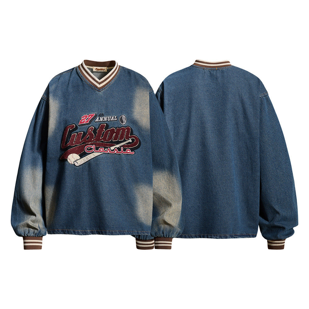 Oversized vintage washed denim V-neck sweatshirt with chenille baseball embroidery graphic and striped ribbed cuffs, front an