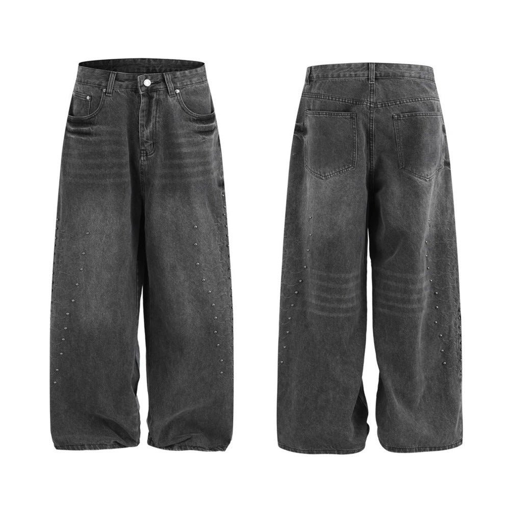 Men's baggy wide-leg washed denim jeans with metal stud embellishments, shown in charcoal grey front and back view