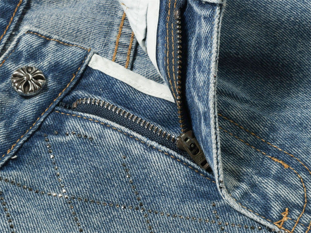 Close-up of light blue jeans zipper fly and front pocket area