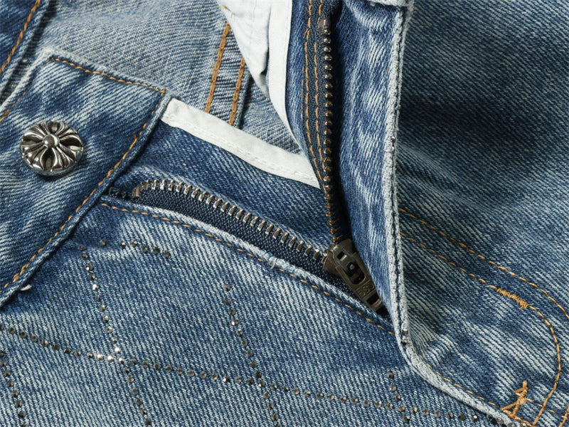 Close-up of light blue jeans zipper fly and front pocket area