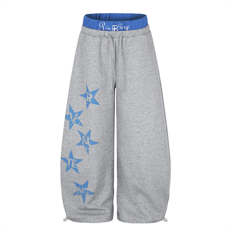Gray wide-leg sweatpants, front view with blue double waistband and star graphic print