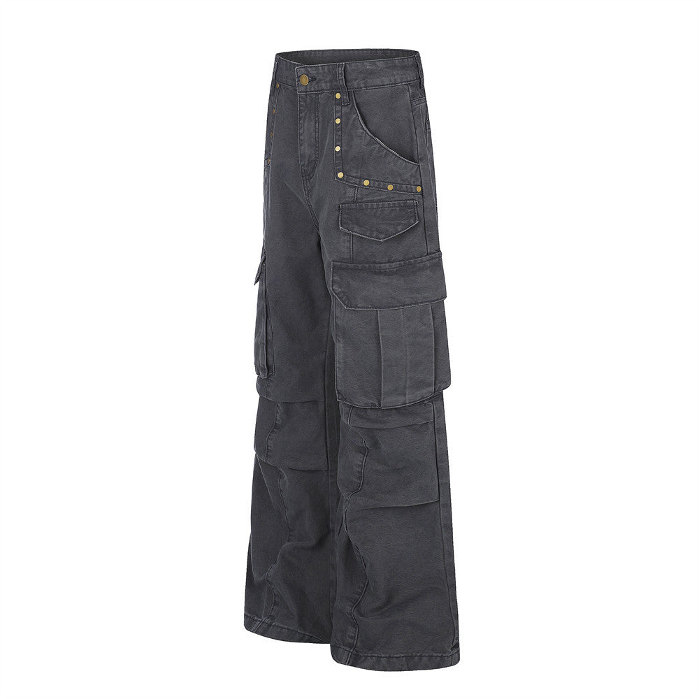 Black wide-leg cargo pants angled front view with flap pockets and studded trim