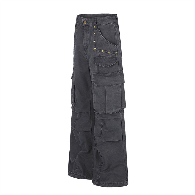 Black wide-leg cargo pants angled front view with flap pockets and studded trim