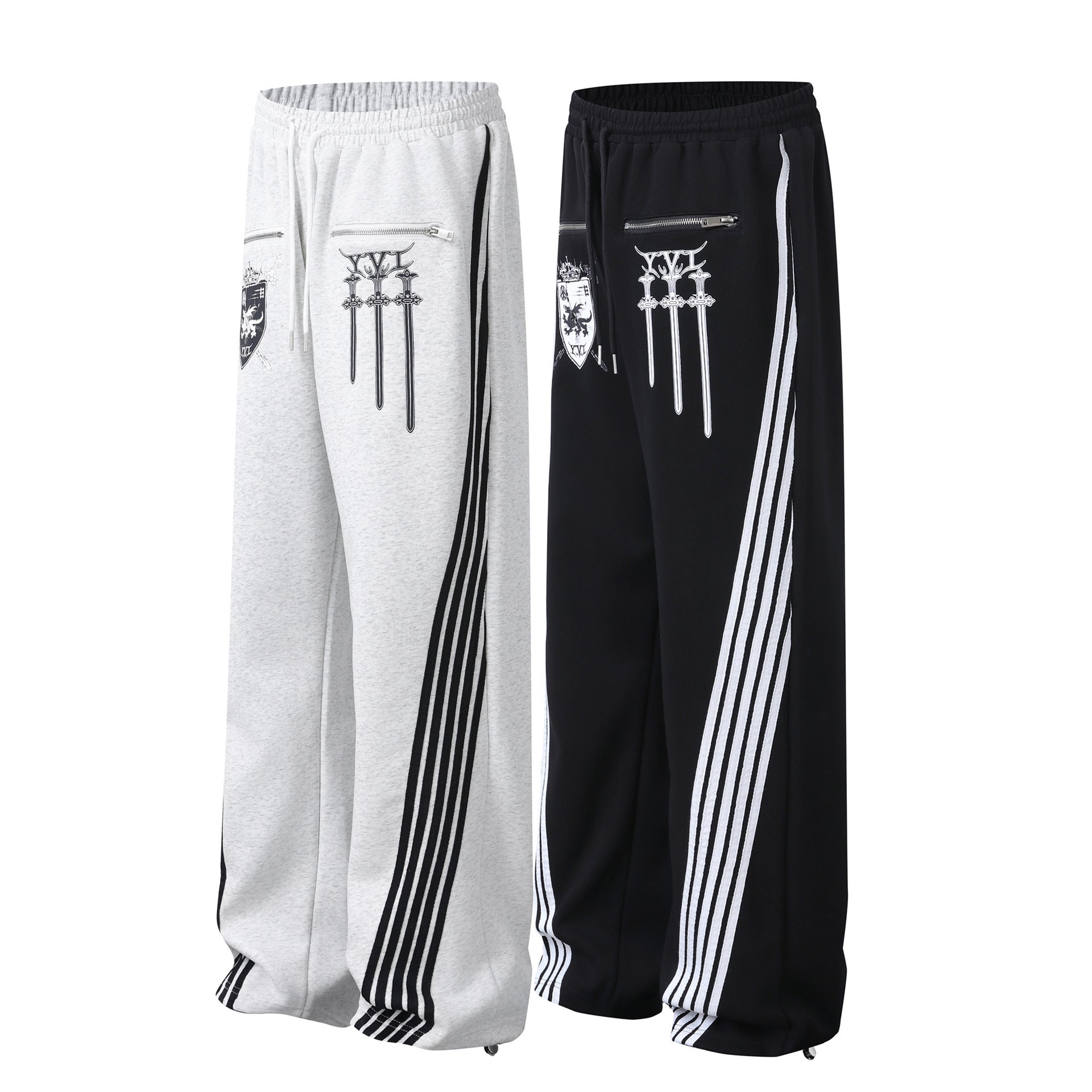 Pantalon de survêtement à jambes larges avec graphisme héraldique et détails latéraux multibandes