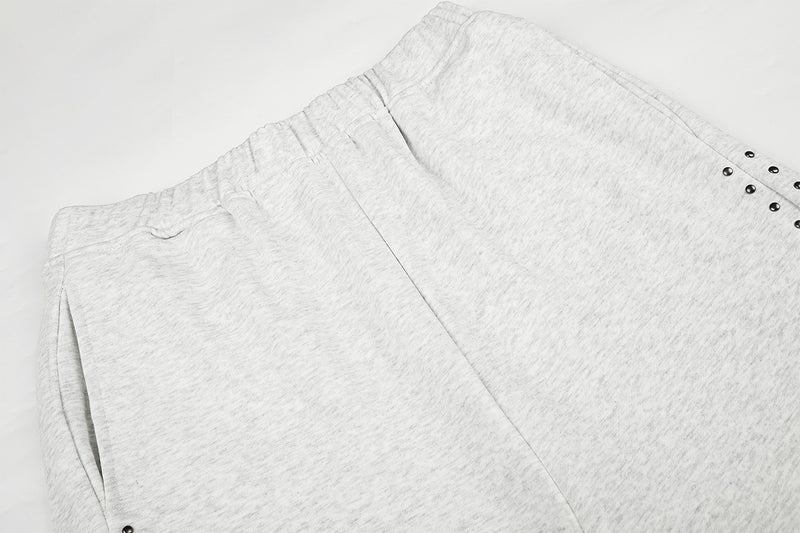 Jogging à jambes larges avec clous – Coupe ample et croix ornée de strass