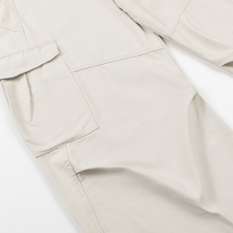 Cream cargo pants close-up of pocket and leg seam