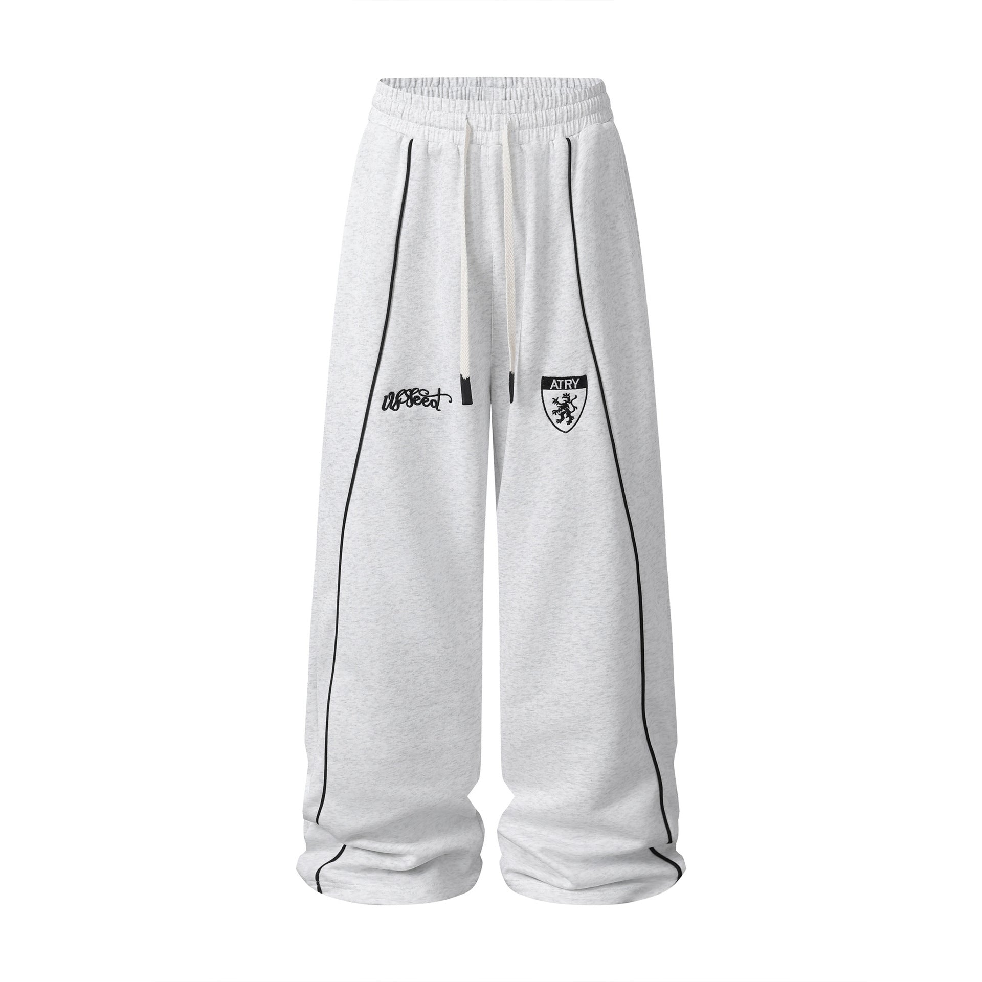 Pantalon de survêtement à jambes larges gris chiné avec passepoil contrastant noir et écusson brodé sur le devant de la cuisse
