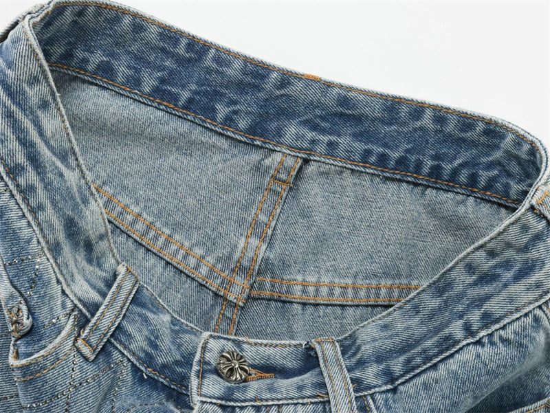 Close-up of light blue jeans waistband and inner waist seam with top button