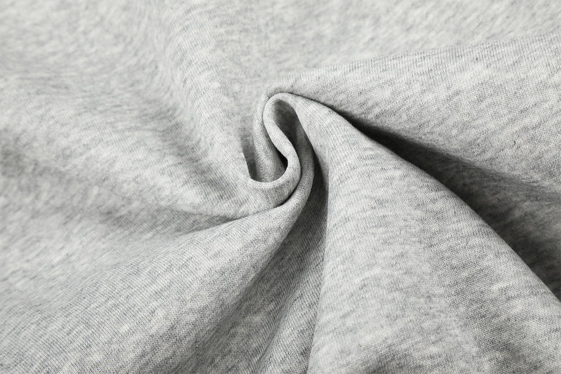 Sweat à capuche zippé avec écusson croix clouté et doublure camouflage