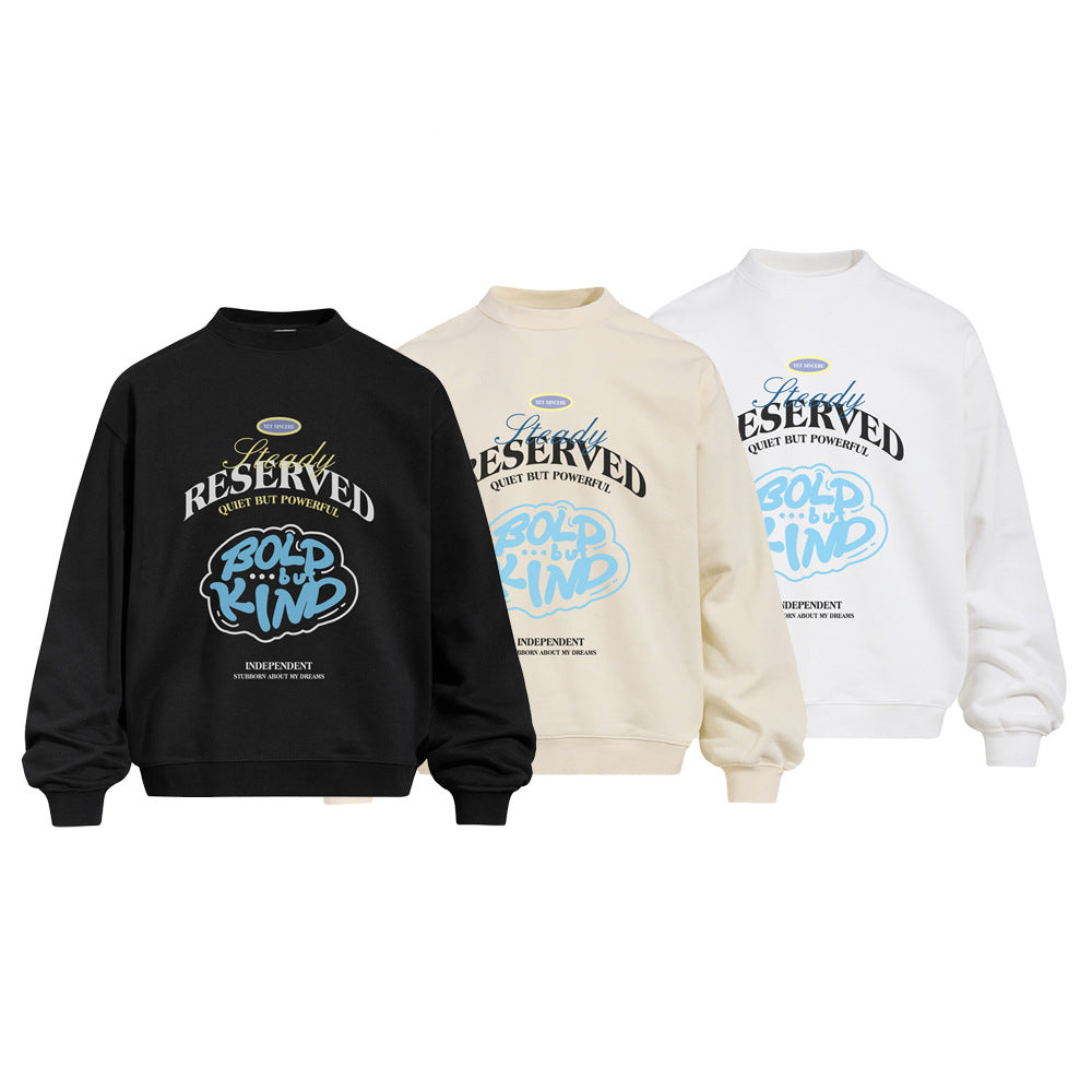 Oversized crewneck sweatshirt with bold letter graphic print in white, black, and cream colorways