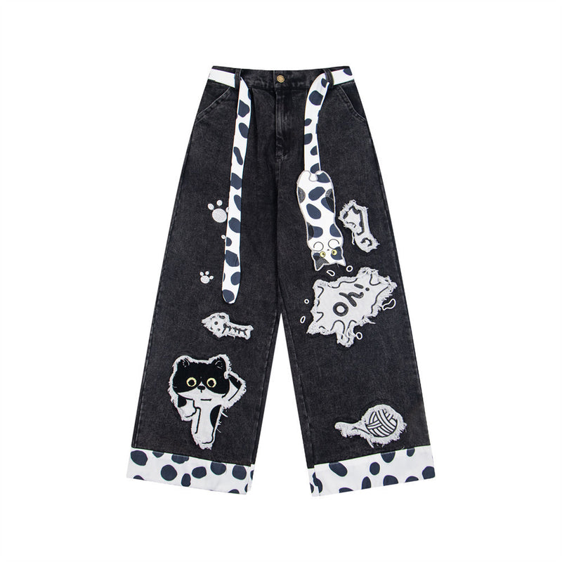Jean noir large avec patchs chat cartoon et finitions contrastantes imprimées dalmatien