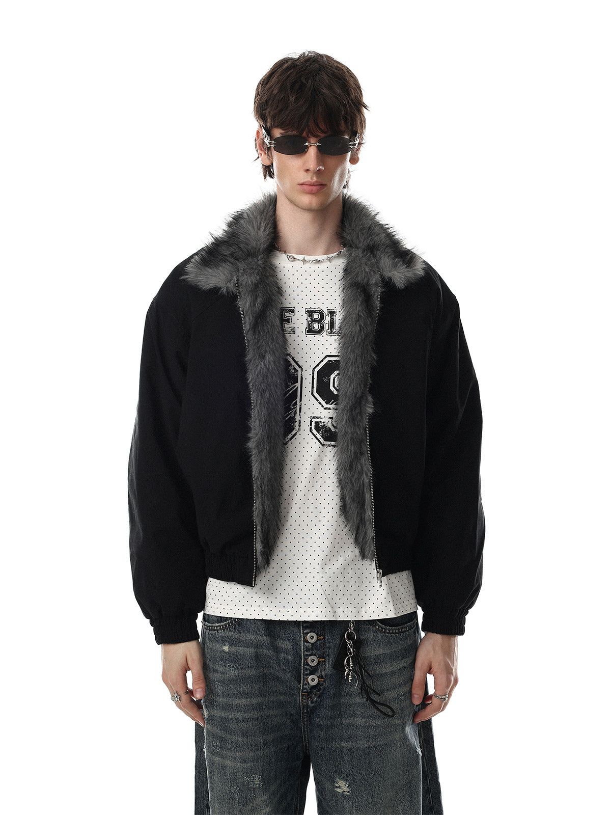 Oversized padded bomber jacket with grey faux fur collar shown in black, worn open over a graphic tee with distressed jeans