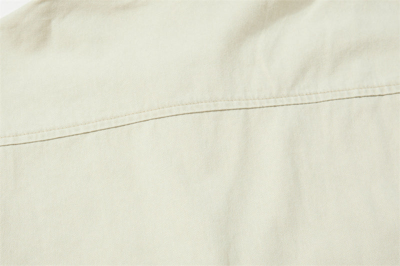 Back yoke seam detail on cream shirt