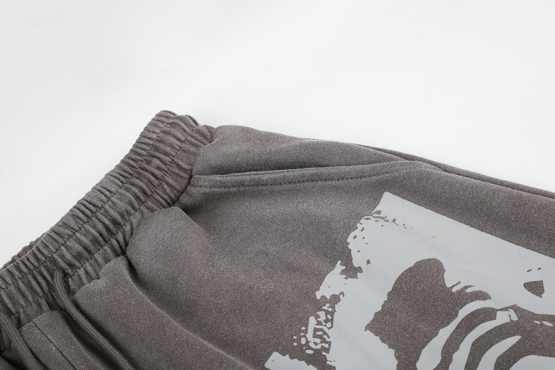 Pantalones de chándal de pierna ancha con cruz estampada y acabado lavado ácido