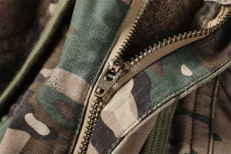 Close-up of camouflage shorts zipper fly and front seam detail