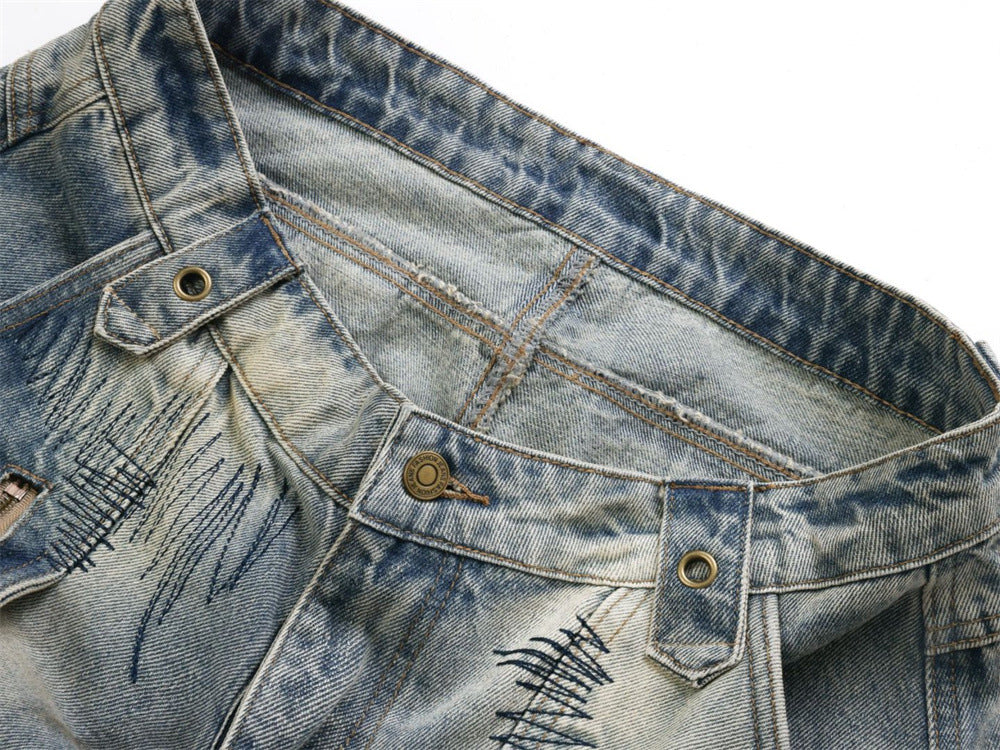 Baggy Wide-Leg Jeans – Chaotic Embroidery, Distressed Denim & Arc-Hem Design