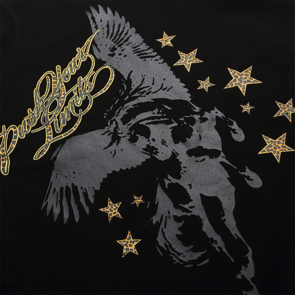 Close-up of Pegasus graphic with gold script and star print on black T-shirt