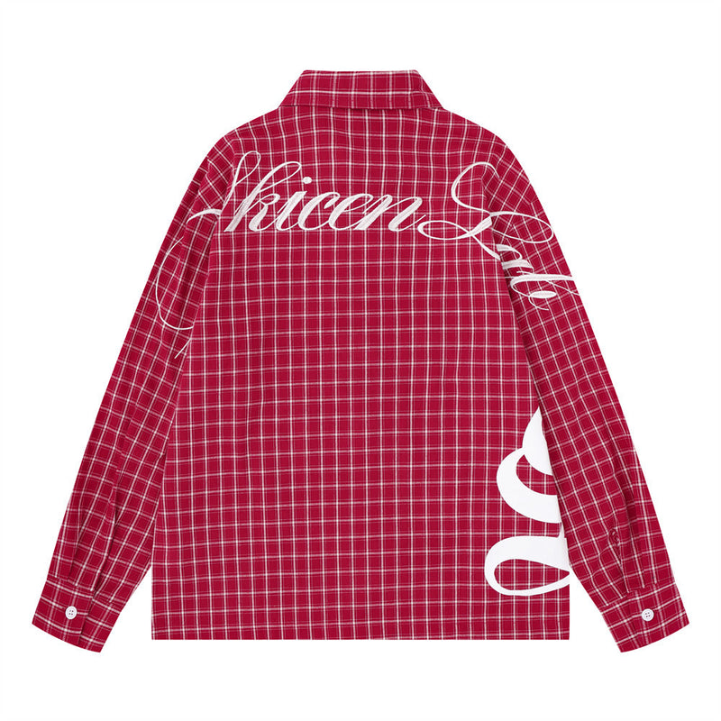 Red plaid long sleeve shirt back view with large white Gothic script across the shoulders