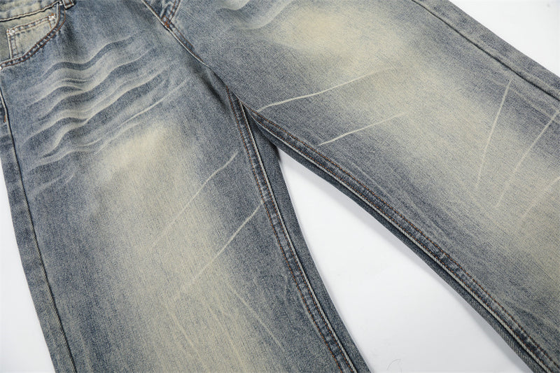 Vintage Washed Wide-Leg Flare Jeans – Distressed Faded Denim with Crease Detail