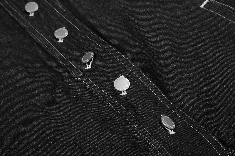 Close-up of black jacket front snap placket and top buttons