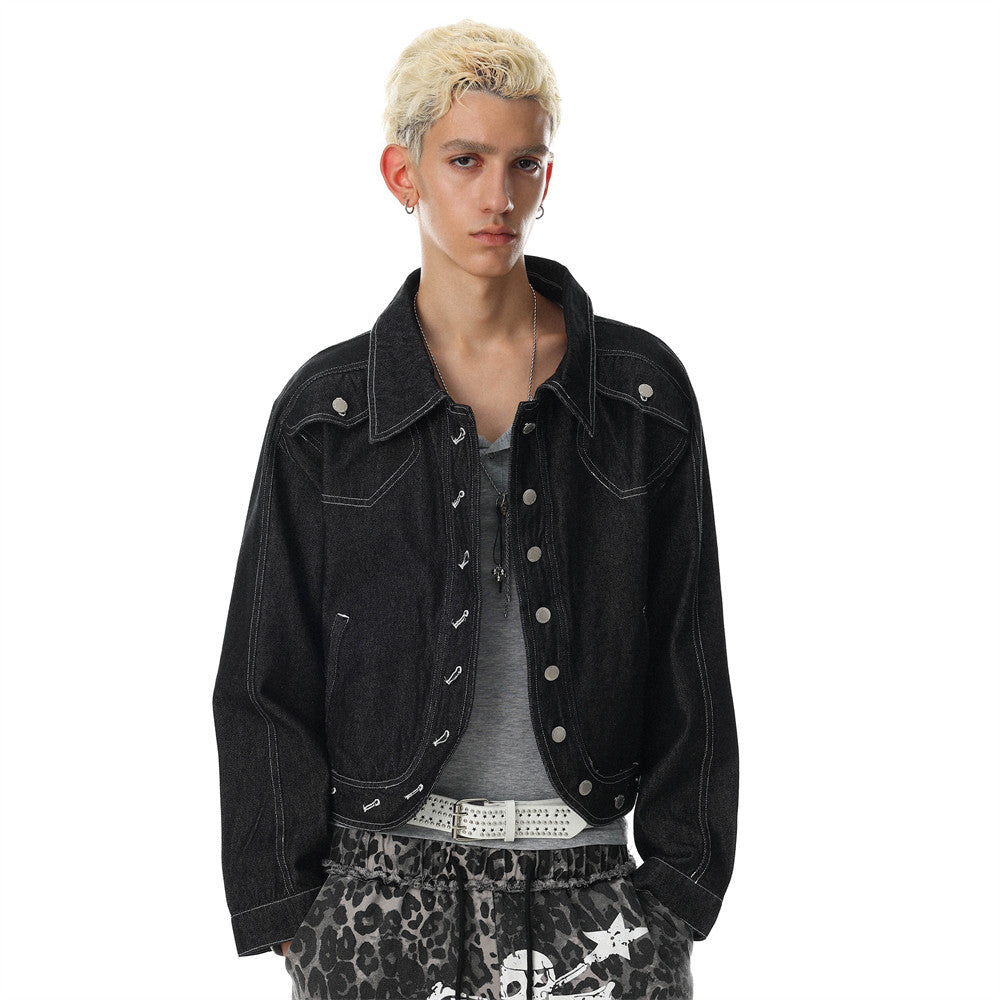 Men's oversized black denim jacket with silver snap buttons, contrast white stitching, and cropped boxy silhouette — front an