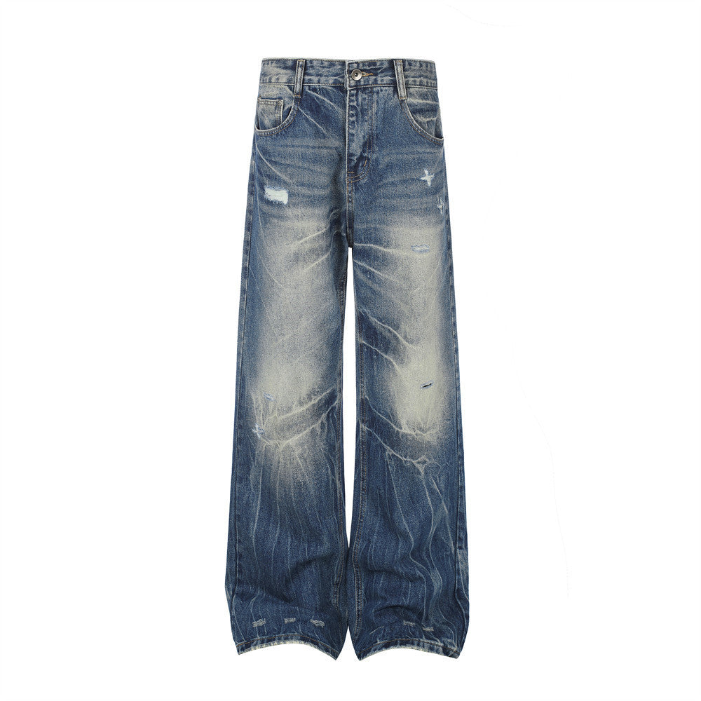 Jean homme wide leg délavé effet usé, dégradé et plis façon éclairs, en denim bleu vintage