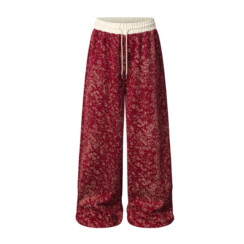 Pantalon de survêtement à jambes larges en maille jacquard effet usé, avec ceinture côtelée crème, coloris rouge, vue de face