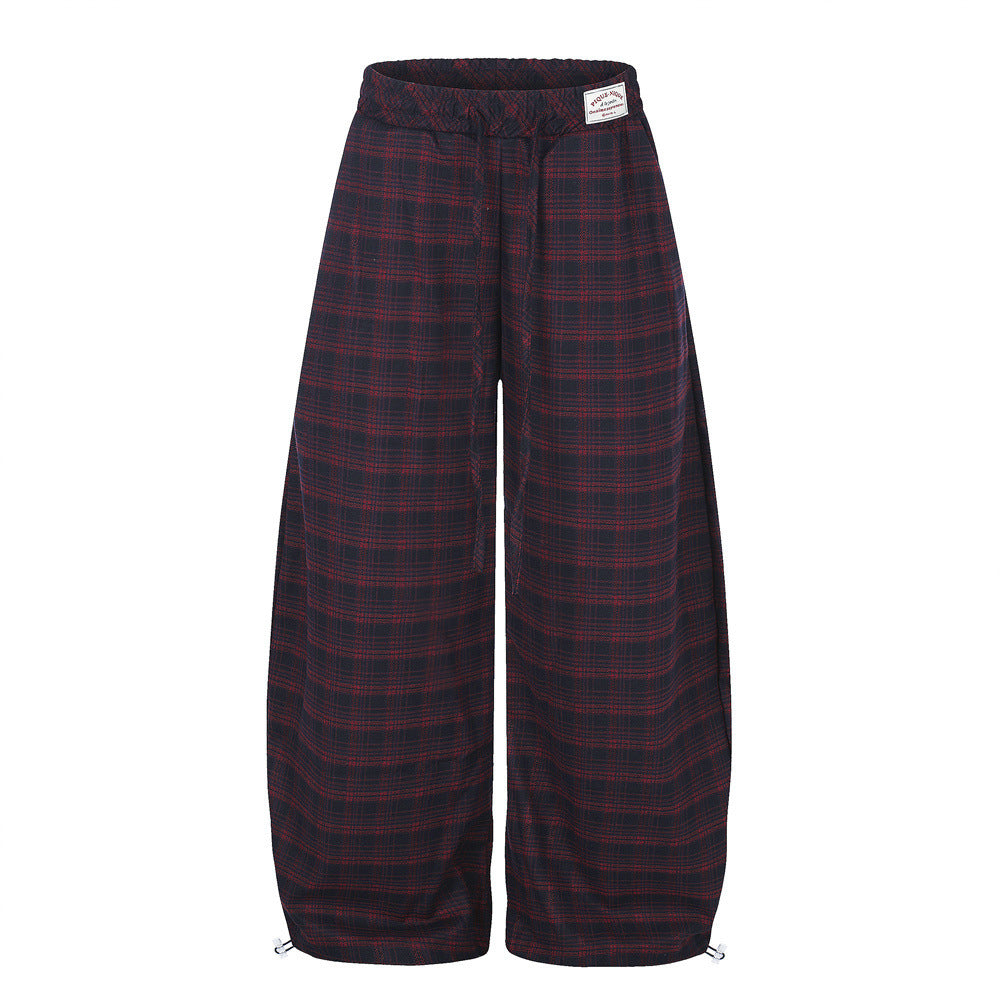 Oversized wide-leg plaid baggy trousers in navy-red tartan check with cinched ankle drawcord and elasticated waistband