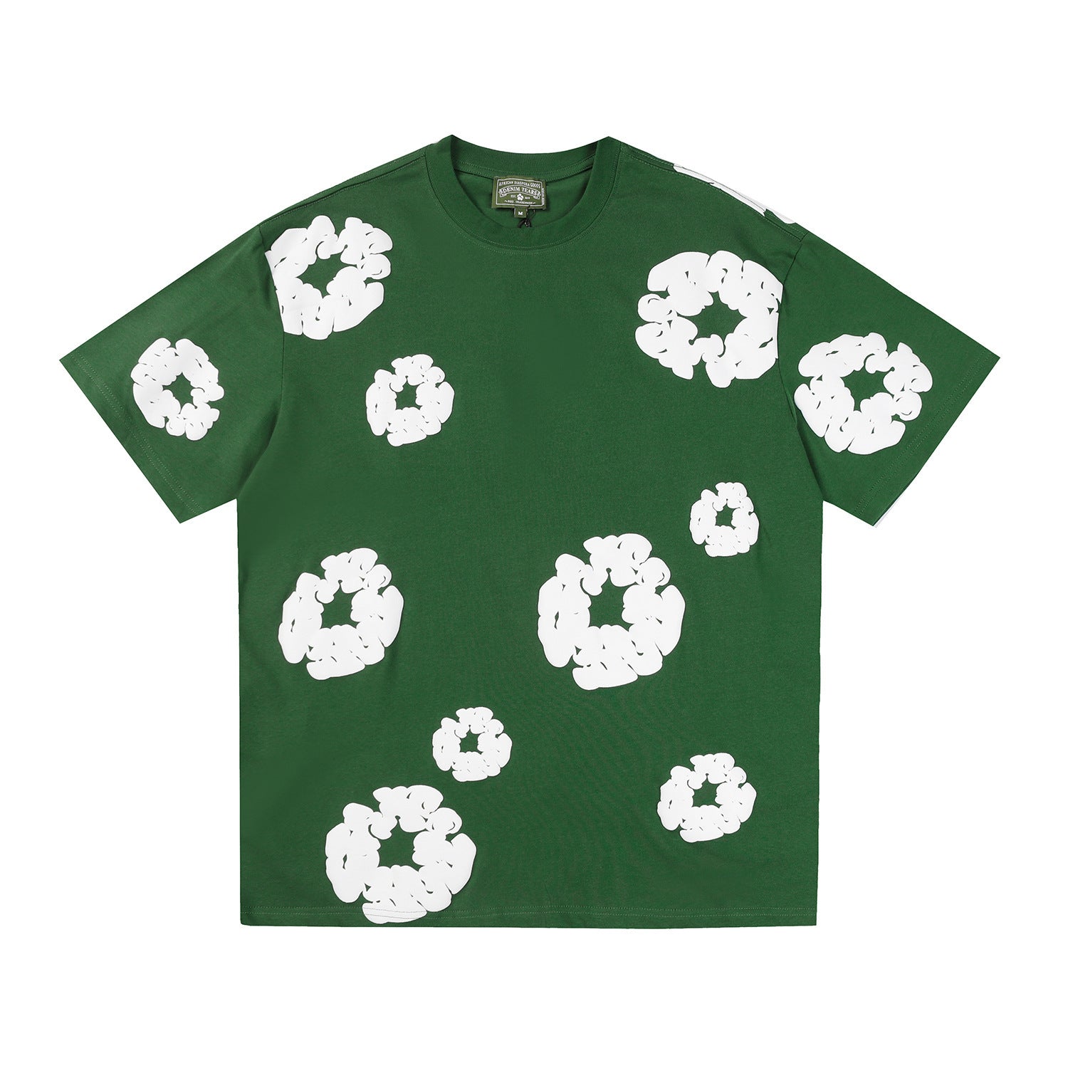 Denim Tears green cotton T-shirt with allover white wreath print on front and sleeves, laid flat on white background