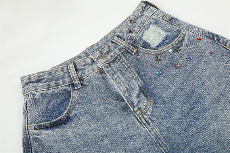 Jean large déchiré pour homme avec ornements en strass et étoiles