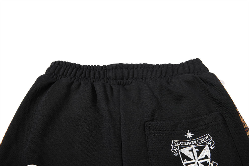 Dark Streetwear Wide-Leg Sweatpants with Leopard Side Tape & Script Print