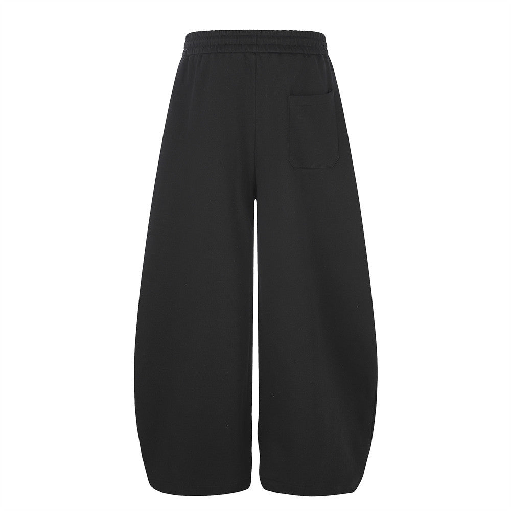Pantalon de survêtement homme à jambes larges, motif graphique – Écusson licorne et slogan imprimé noir