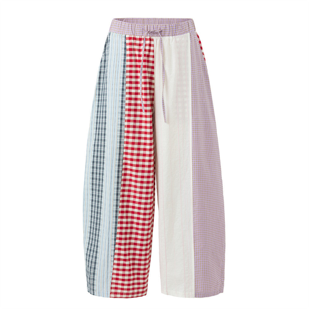 Men's patchwork plaid wide-leg pants with colorblock red gingham, navy plaid, lavender check, and cream panels, elasticated d