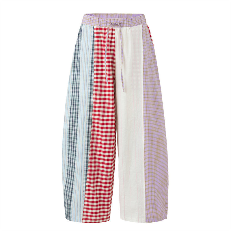 Men's patchwork plaid wide-leg pants with colorblock red gingham, navy plaid, lavender check, and cream panels, elasticated d