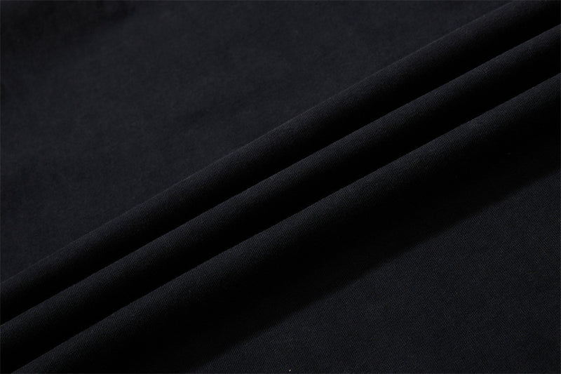 Close-up of smooth black knit fabric with soft folds