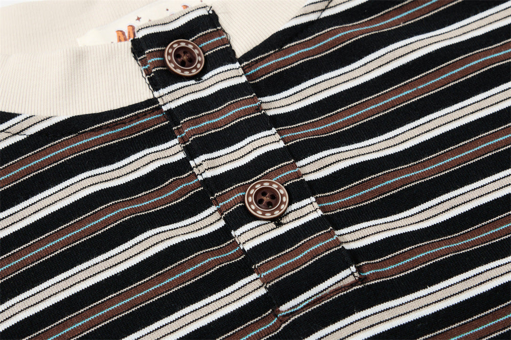 Close-up of Henley button placket on black striped shirt with cream ribbed collar