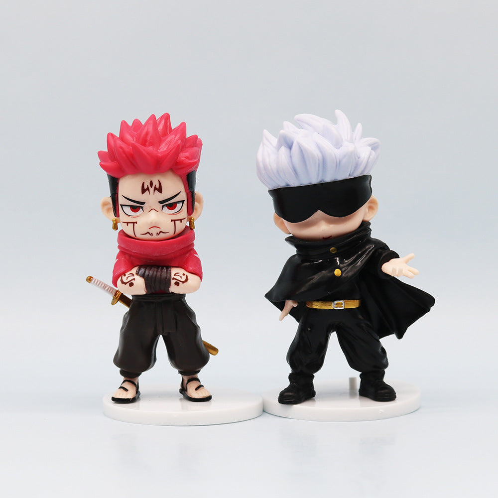 This Jujutsu Kaisen Q Edition Spell Return set includes two chibi-style figures: one with red spiky hair, facial markings, and a sword, and the other with a black blindfold, white spiky hair, and a cape. Both stand on white bases within this 11 cm collectible PVC set.