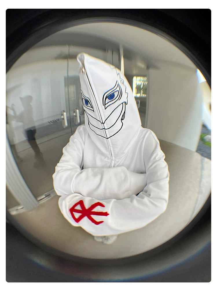 Dressed in the Berserk Griffith-Inspired Hoodie, an oversized white zip-up, a person with a mask-like hood reveals blue eyes and a grin. With crossed arms and the Brand of Sacrifice on the sleeve, this fisheye lens image captivates fans who cherish intrigue and mystery.