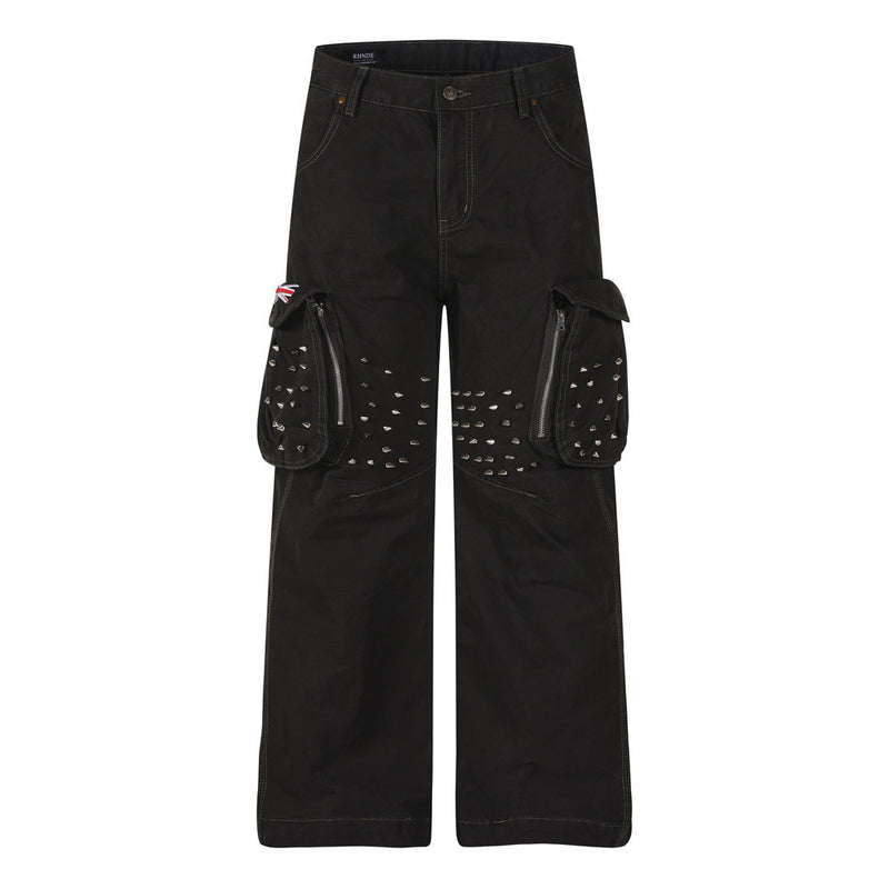 Front view of black cargo pants with studded flap pockets and wide straight legs