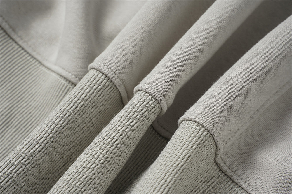 Sweat à capuche oversize zippé – Finition délavée usée, poches à multiples zips et bords bruts