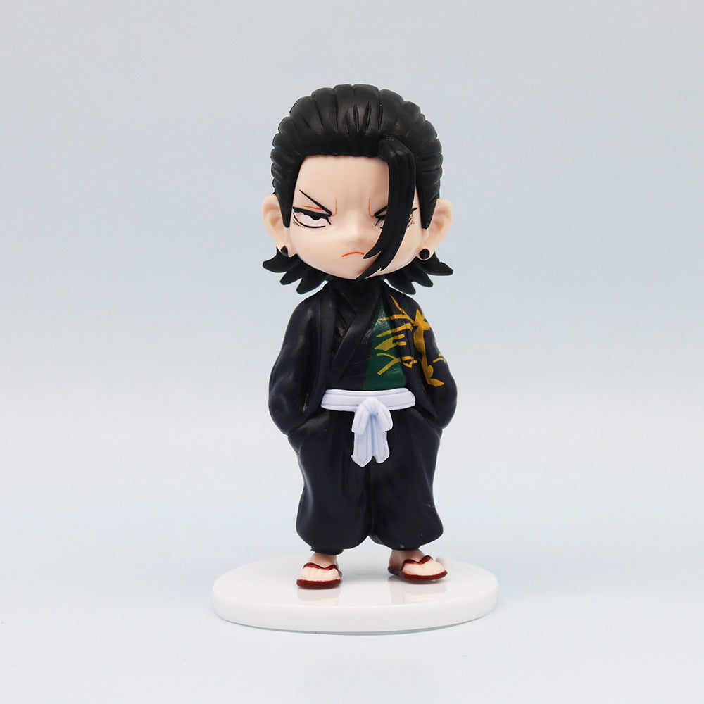 Part of the Jujutsu Kaisen Q Edition Spell Return 7-Piece Set, this chibi-style PVC figurine features a character with black hair, dressed in a black outfit with green and yellow patterns, a white belt, red sandals, and standing seriously on a white base.