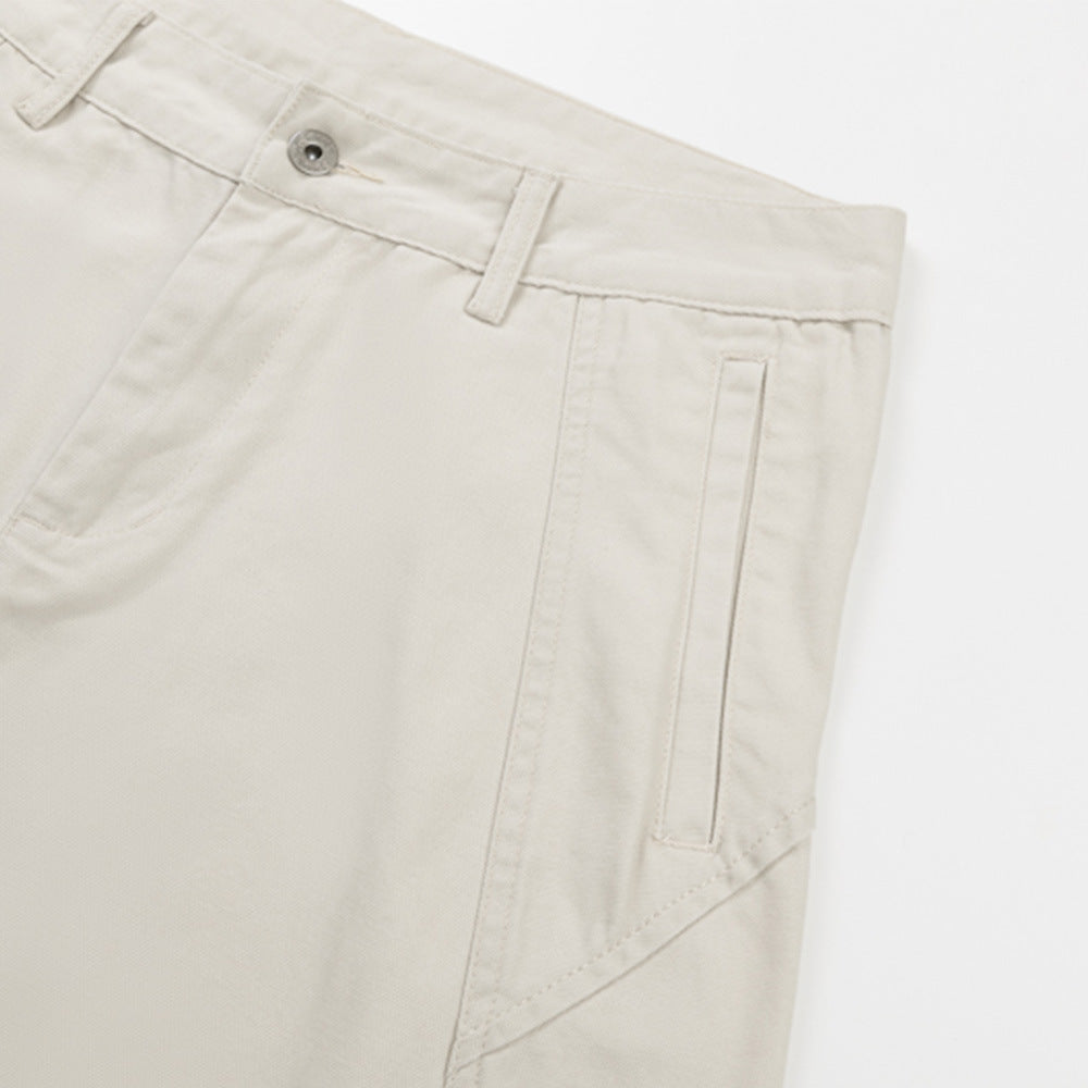 Cream pants side seam with belt loop and vertical pocket detail