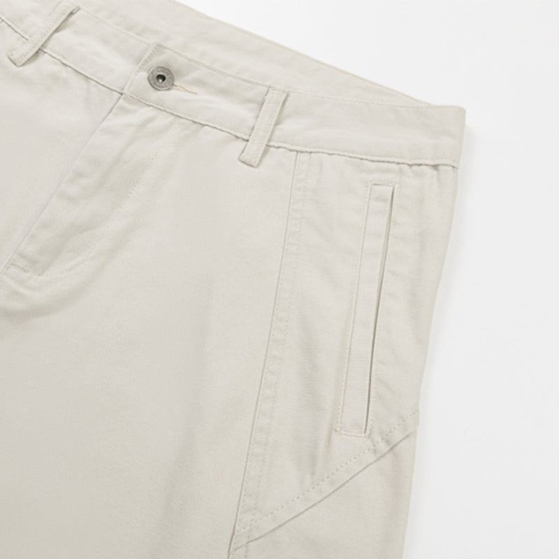 Cream pants side seam with belt loop and vertical pocket detail