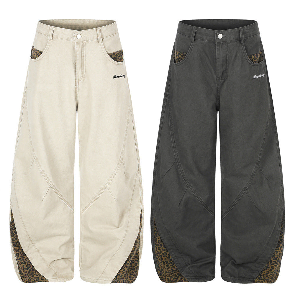 Pantalones de Pierna Ancha con Patchwork de Leopardo – Corte Baggy Deconstruido y Bajo Curvado