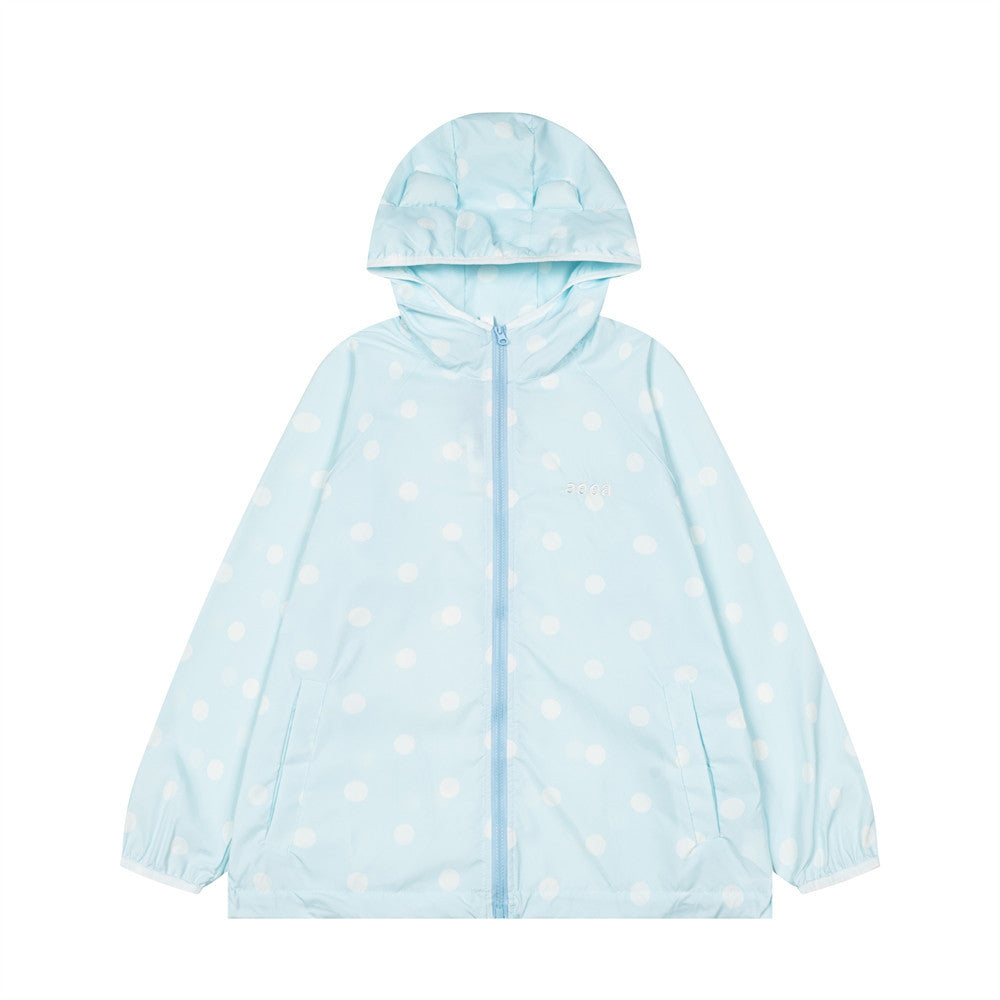 Unisex oversized polka dot hooded windbreaker jacket in light blue with white dots, full-zip front and elasticated cuffs