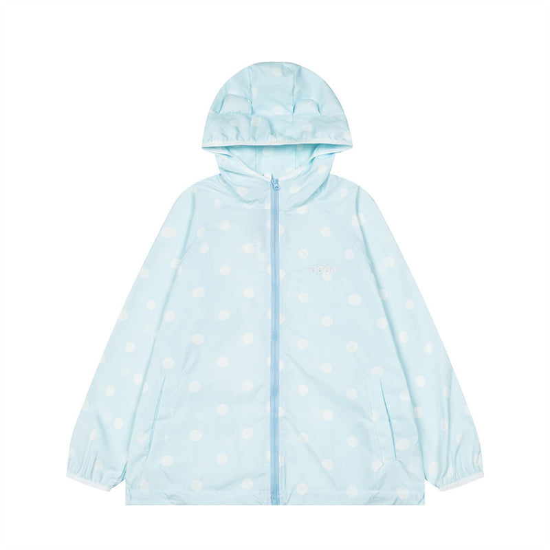 Unisex oversized polka dot hooded windbreaker jacket in light blue with white dots, full-zip front and elasticated cuffs
