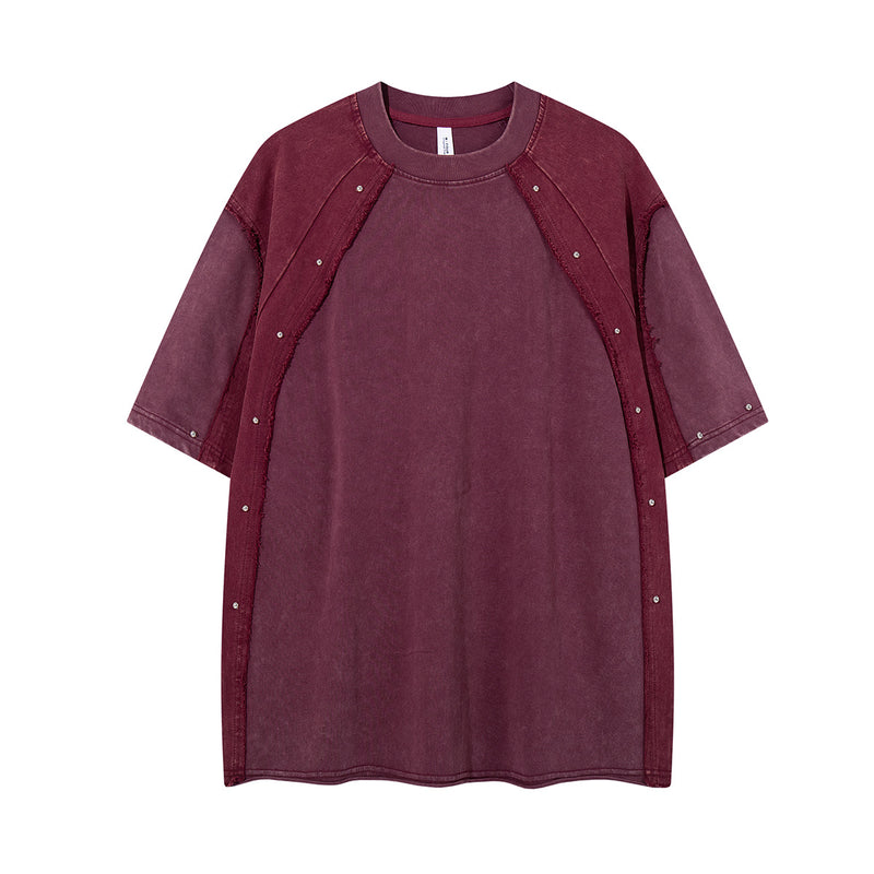 T-shirt patchwork raglan délavé à l’acide, coutures à bords bruts et détails rivetés