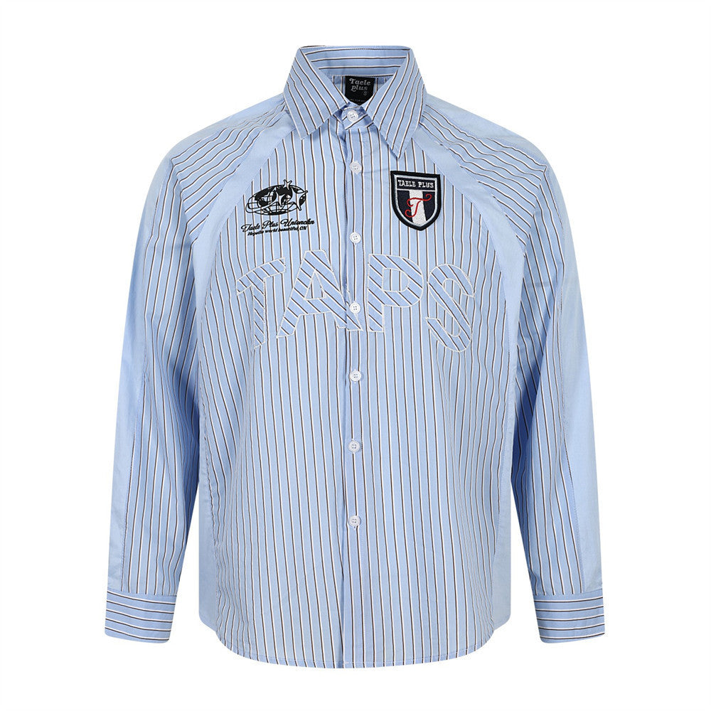 Men's light blue vertical pinstripe long-sleeve button-down shirt with embroidered lettering and shield badge patch, front an