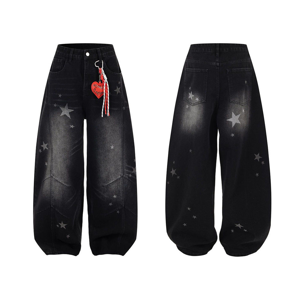 Men's washed black wide-leg baggy jeans with all-over star print and detachable red heart charm, front and back view